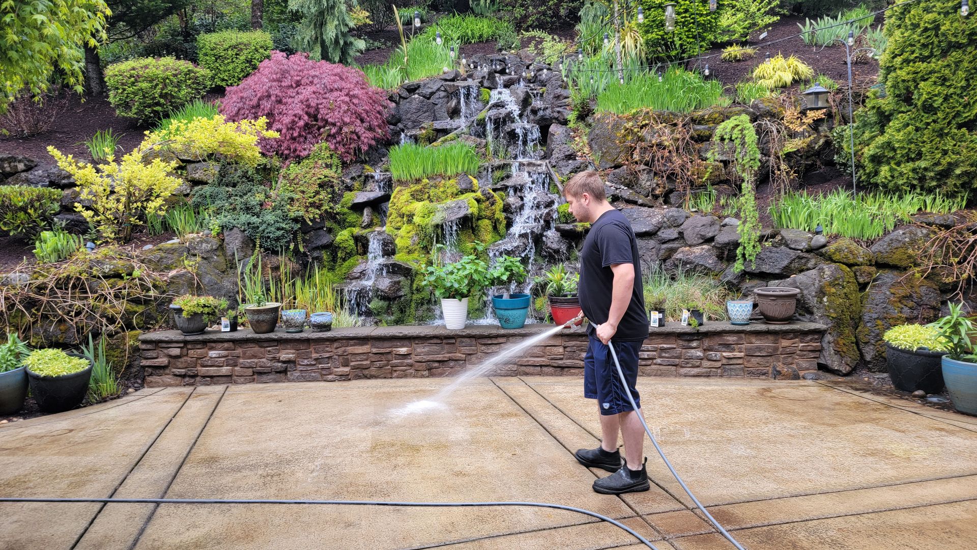 Mountain View Pressure Washing cleaning a concrete patio in Clark County, WA