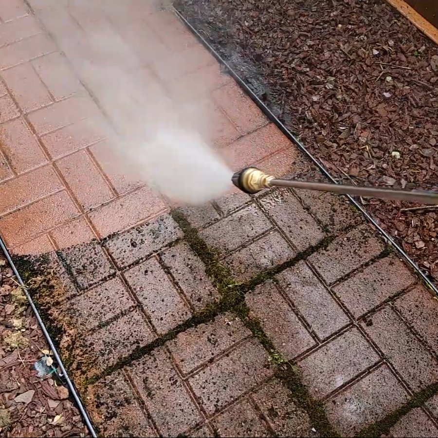 Pressure washing mossy brick pavers in Vancouver, WA