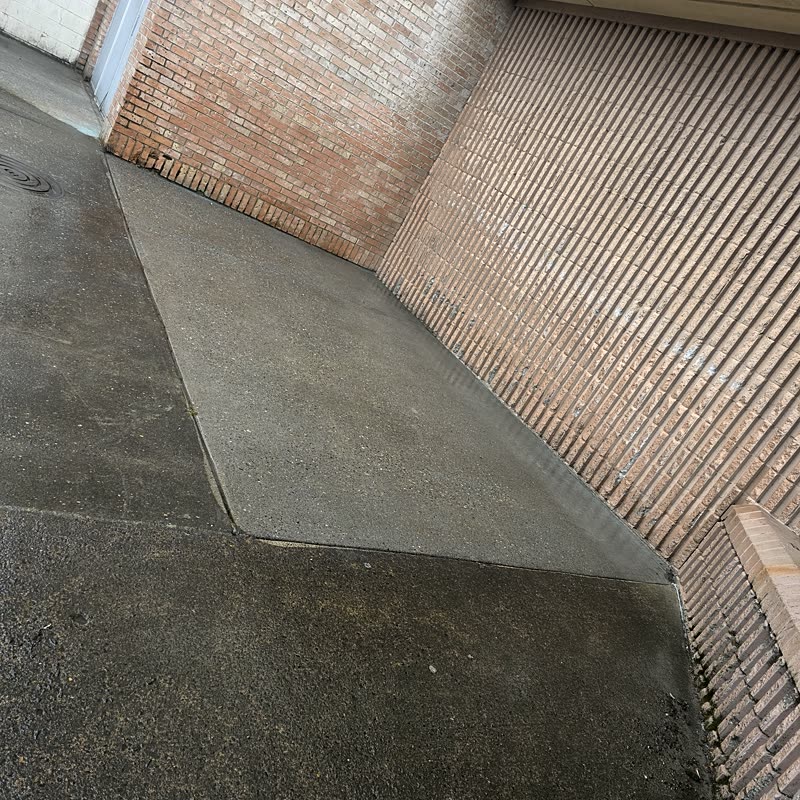 Clean concrete beside a brick wall in Vancouver, WA