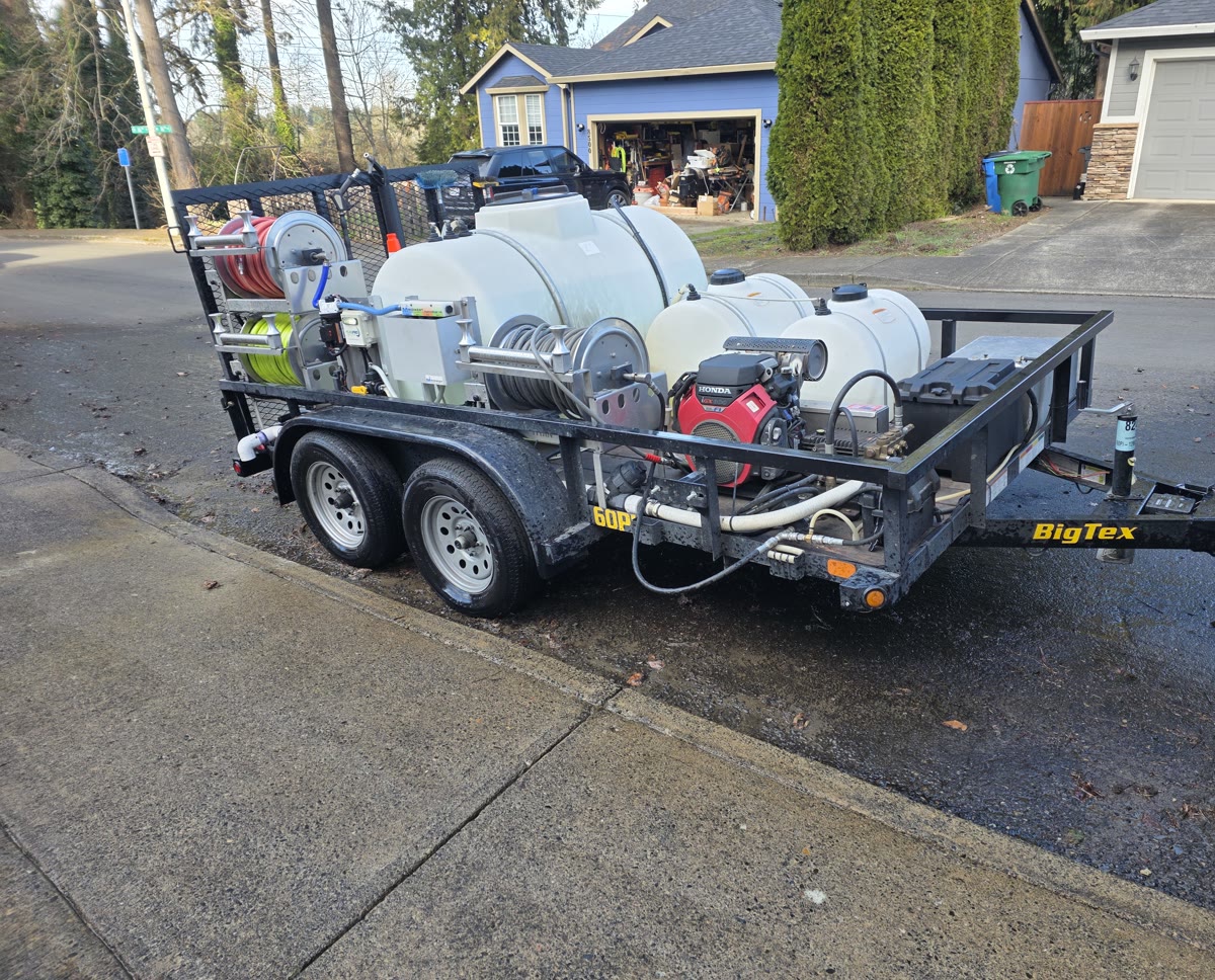 Mountain View Pressure Washing And Softwash trailer rig with tanks, hose reels and engine